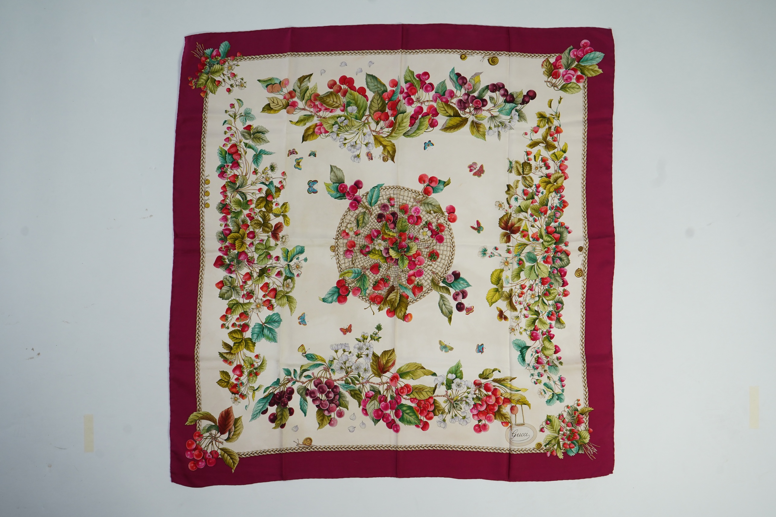 A vintage Gucci silk scarf with a design of strawberries and cherries, 86 x 87cm